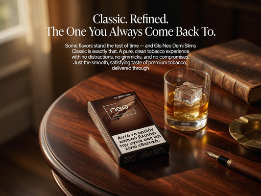 A dark brown pack of Gio Neo Demi Slims cigarettes sits on a polished wooden table next to a glass of whiskey with ice, with a book and pen nearby. White text at the top reads 'Classic.