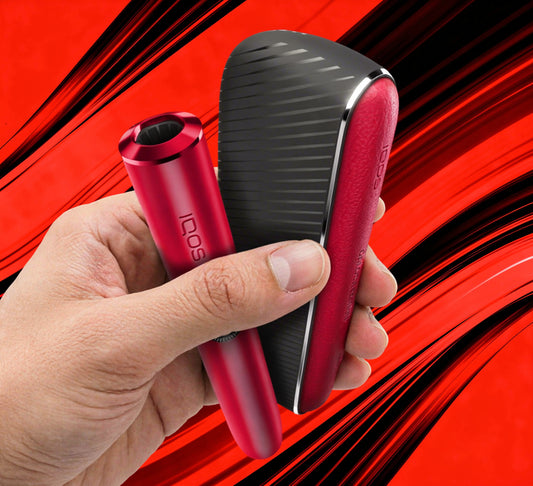 A hand holding two red and black electronic beauty devices, one cylindrical and one curved, with the brand name 'idos' visible on both items, set against a dynamic red and black background.