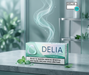 Box of Delia Classic Green dental floss on a marble surface with a blurred background