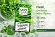 Veo Tobacco Free Green Click menthol pouch packaging standing on a light stone surface with mint leaves, ice cubes, and a glass bowl of mint in the background. Text on the right describes the flavor as fresh, creamy mint, with cooling sensation, minty freshness, and tobacco free.