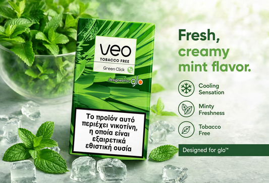 Veo Tobacco Free Green Click menthol pouch packaging standing on a light stone surface with mint leaves, ice cubes, and a glass bowl of mint in the background. Text on the right describes the flavor as fresh, creamy mint, with cooling sensation, minty freshness, and tobacco free.