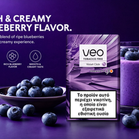 A package of VEO Tobacco Free Violet Click blueberry flavor rolling paper stands next to a glass of purple blueberry smoothie on a dark purple background, with blueberries scattered around and descriptive text on the left.