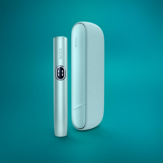 The image shows two components of the IQOS ILUMA i Kit in Breeze Blue. One is the cylindrical device itself with a touch screen on the front, and the other is a rectangular case or charger.