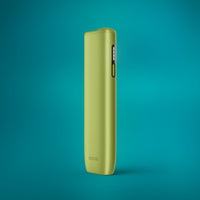 A leaf green IQOS ILUMA i One device against a teal background.