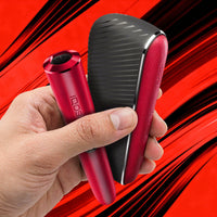 A hand holding two red and black electronic beauty devices, one cylindrical and one curved, with the brand name 'idos' visible on both items, set against a dynamic red and black background.