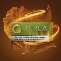 A pack of Terea Soft Fuse for Iodis Isuma tobacco smokeless product, shown in a green and white box with a warning label, surrounded by golden glowing leaves on a dark brown background.